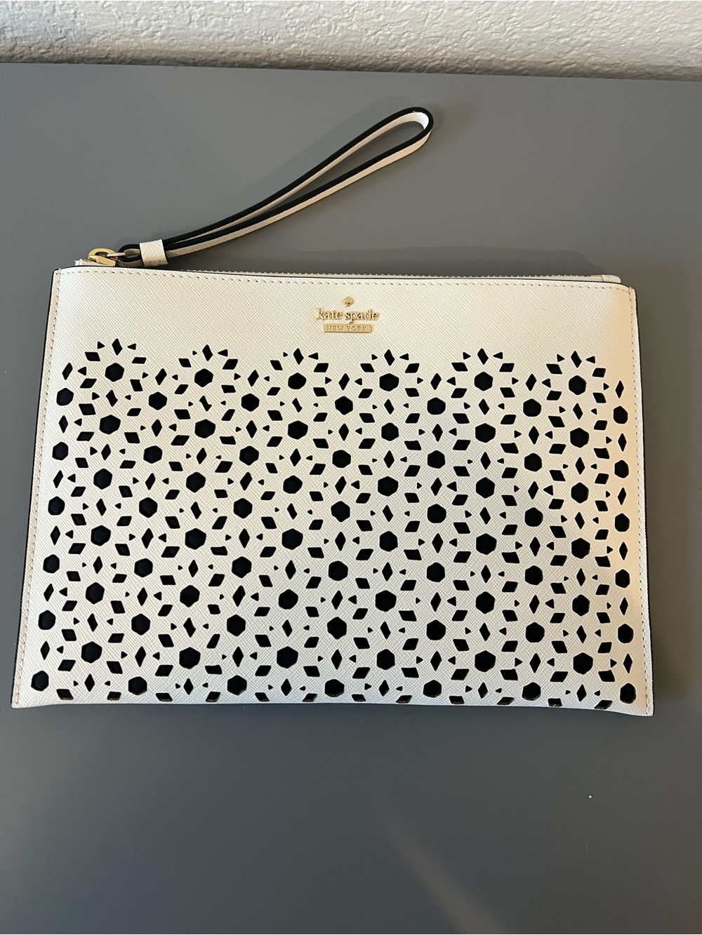 kate spade White and Black Laser-Cut Wristlet Clutch